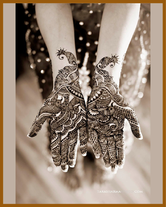 Stylish Peacock Front Hand Mehndi Design Combining Petals And Swirls
